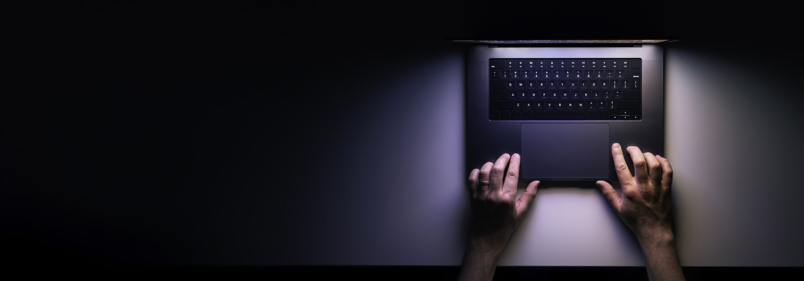 Man Using Laptop Night Top View Web Banner With Copy Space Scaled